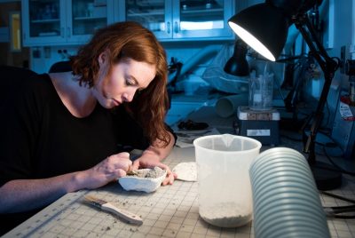 A graduate student prepares a fossil in a Virginia Tech research lab.